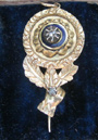 Hand brooch