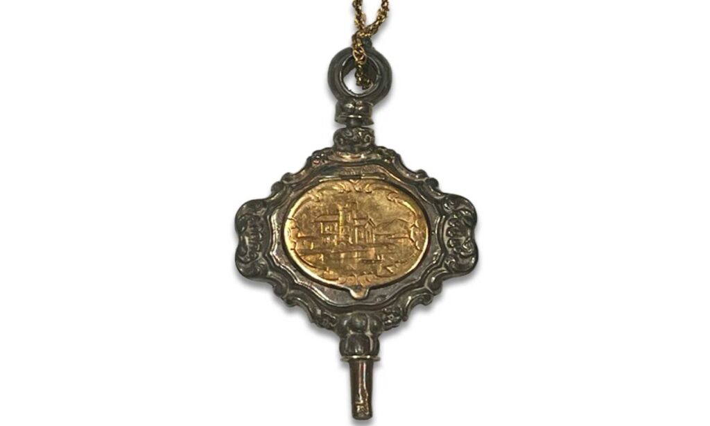 19th century pocket watch key closed with castle design exterior. Courtesy Mark Mays.