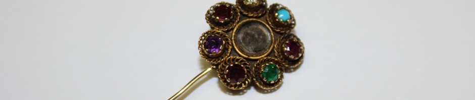 Acrostic sentimental stickpin with woven hair.