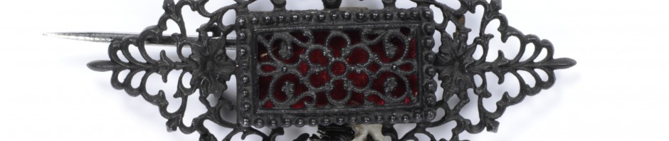 Cast-iron jewellery was an inexpensive but fashionable novelty for consumers in Europe and America from around 1800 to 1860. Developed in Germany in 1806–7 and often worn during mourning, it became the symbol of Prussian patriotism and resistance to Napoleon I in the Prussian War of Liberation fought from 1813-15. Women donated gold jewellery to their country in exchange for iron inscribed ‘I gave gold for iron’. The transformation of cast iron, a dark metal of little value, into a fashionable product was an important Prussian manufacturing success. Factories became adept at casting small, delicate parts which could be assembled to create the jewellery. A renewed interest in the Medieval past throughout Europe brought stylistic change. After 1815, the Neo-classical designs of earlier Berlin ironwork were replaced by Gothic motifs such as the trefoil, quatrefoil, and fine pointed arches. The jewellery quickly gained an international profile. Demand peaked in the 1830s, when Berlin alone had 27 foundries and manufacture spread to France and Austria.