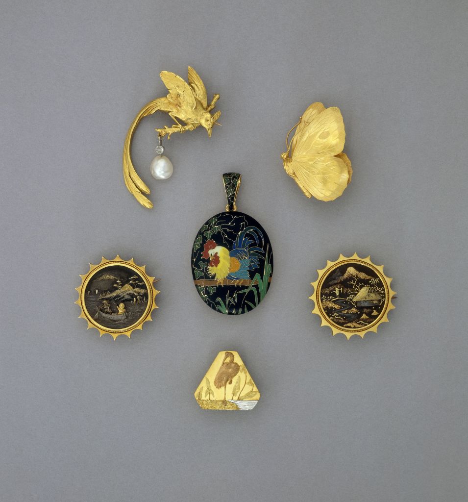 Chased gold brooch in the form of a butterfly with folded wings. Warranty mark and illegible maker's mark. Image top right.