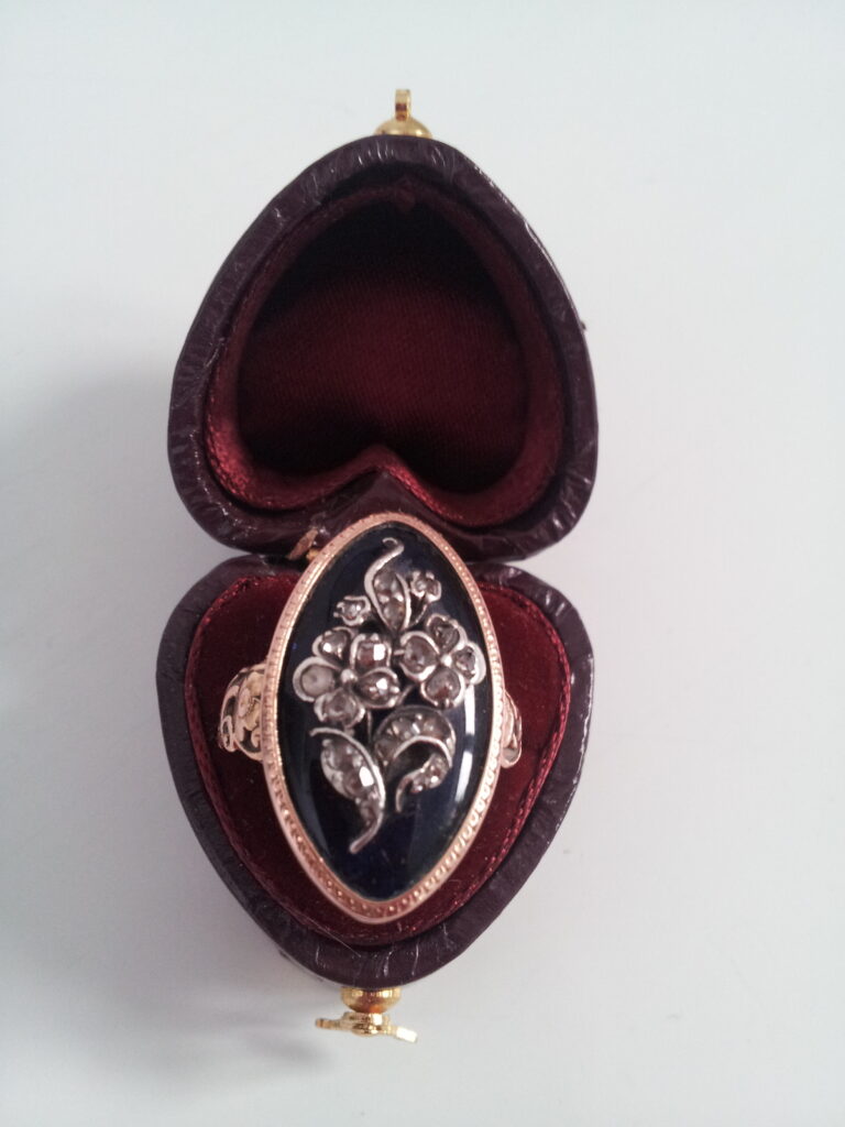 Forget-me-not and rose ring, with blue enamel, and diamond. Image courtesy of Julie Strawinski.