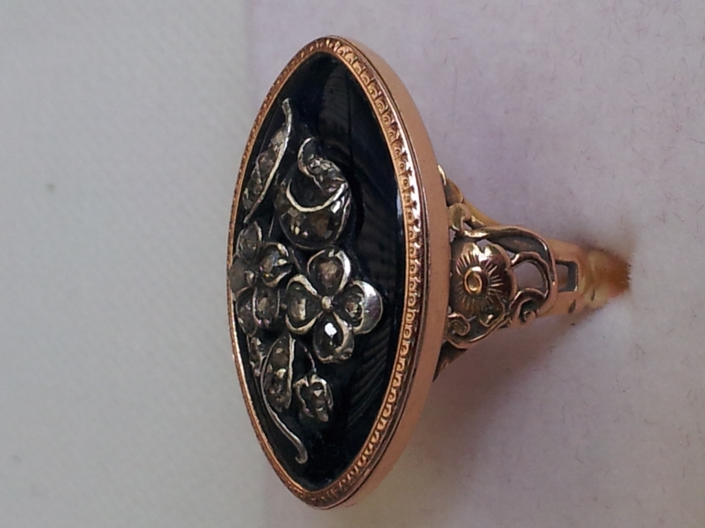 Forget-me-not and rose ring, with blue enamel, and diamond. Image courtesy of Julie Strawinski.