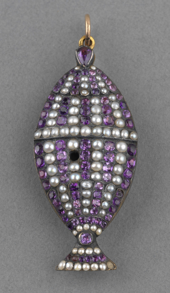 Mourning locket in the form of a funerary urn with seed pearls and amethysts, reverse with lock of hair. Inscribed around edge in gold on white enamel, 'P.ALFRED. BORN 22.SEP 1780 DIED 20 AUG 1782'. Suspension loop.
