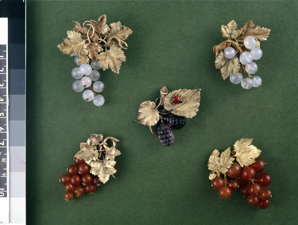 Chased two-colour gold brooch set with carved amethysts in the form of a fruiting mulberry with an enamelled gold ladybird on one leaf. The mulberries are carved on the upper side only.