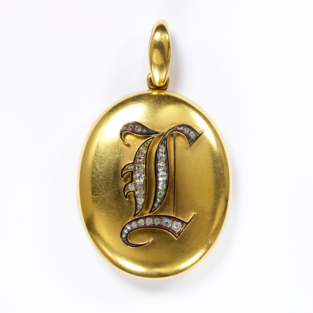 A jeweller made this locket to commemorate someone who had died. The back of it is inscribed 'In remembrance of L.B.F. Oct 7th 1871, from C.G.S.F.'. The widowed husband of the woman in the photograph probably bought the locket and gave it as a keepsake to one of his wife's close friends or relations. Lockets were particularly fashionable items of jewellery from about 1860 to1880 and they have remained popular ever since.