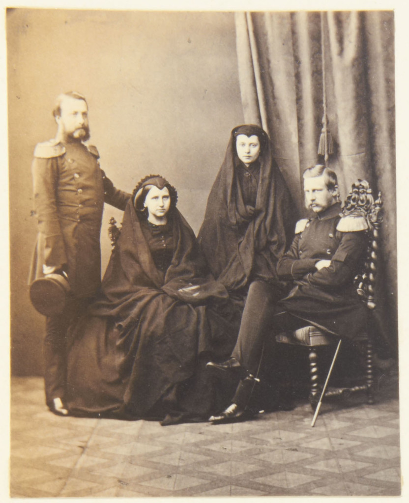 Photograph of a group that includes Frederick, Grand Duke of Baden (1826-1907); Louise, Grand Duchess of Baden (1838-1923); Friedrich, the Crown Prince of Prussia (1858-88) and Victoria, Crown Princess of Prussia (1840-1901). The group wear mourning dress for King Frederick William IV of Prussia. Provenance Acquired by Queen Victoria