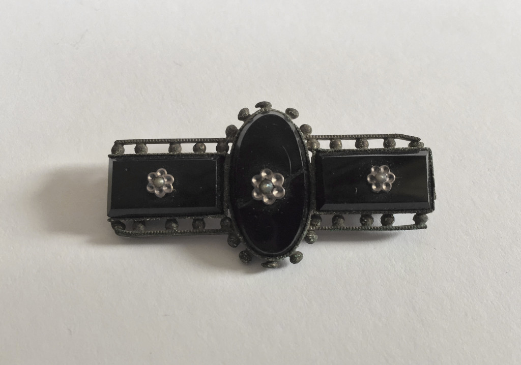 Onyx and silver brooch