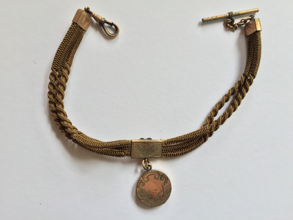 Reverse of blonde fob hair chain, with I initial and photograph, c.1890