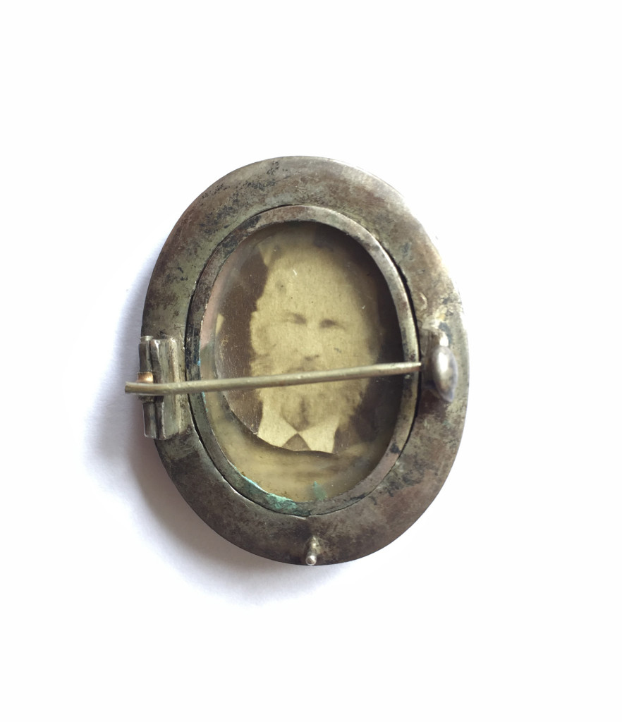 Silver dove brooch with reverse photograph, reverse