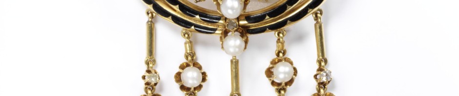 Openwork gold, enamelled in black set with diamonds and pearls, with pearls and diamond pendants