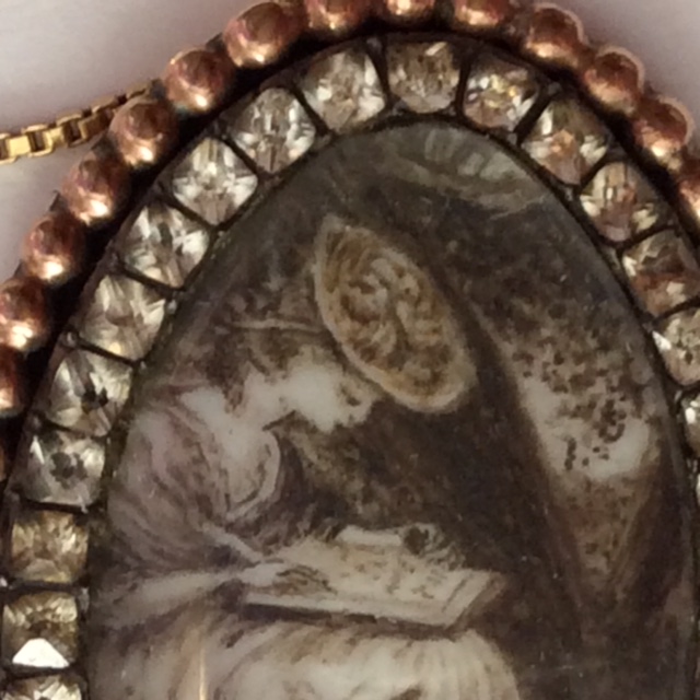 Sepia miniature pendant, depicting a fashionable lady writing, c.1780s. Image courtesy Renee Folzenlogen