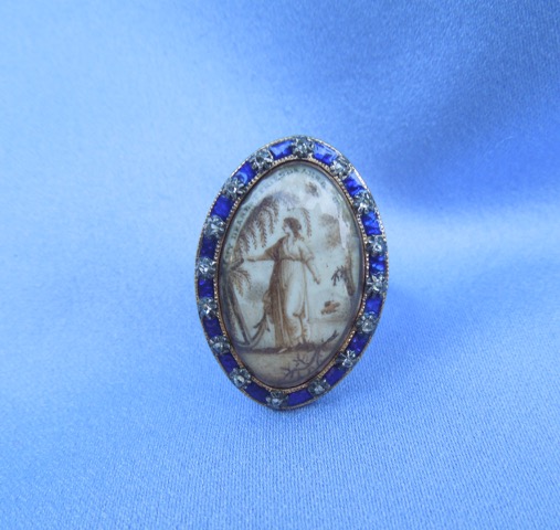 Sepia Neoclassical ring with willow, lady, hope and charity, stating “My Dear Friends Are Gone".