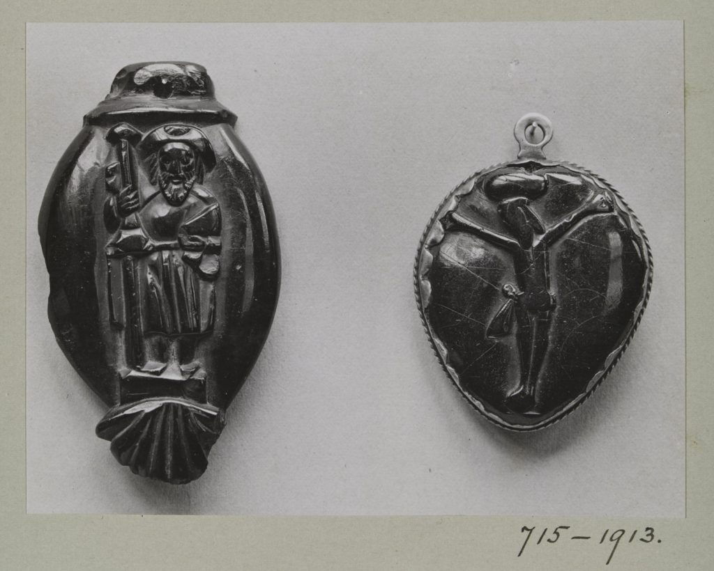 Jet bead of St James the Greater and a jet pendant of the crucifixion, c.1520-1650 and c.1600-1700.