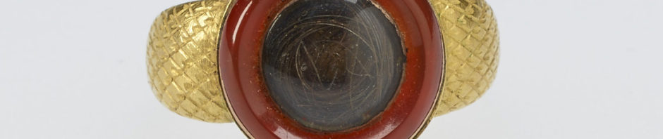 A gold mourning ring chased with diaper pattern. The circular top set with cornelian rim, encircling crystal with hair. Provenance Bequeathed to Princess Elizabeth by her sister Princess Sophia Matilda of Gloucester; on her own death in 1844.