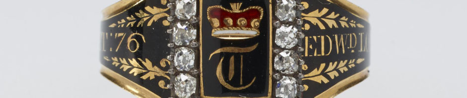 A gold and black enamelled mourning ring. The rectangular top with brilliant-cut diamond rim with baron's coronet above T. Memorial inscription enamelled in gold on black around plain ring. In memory of Edward, Lord Thurlow.