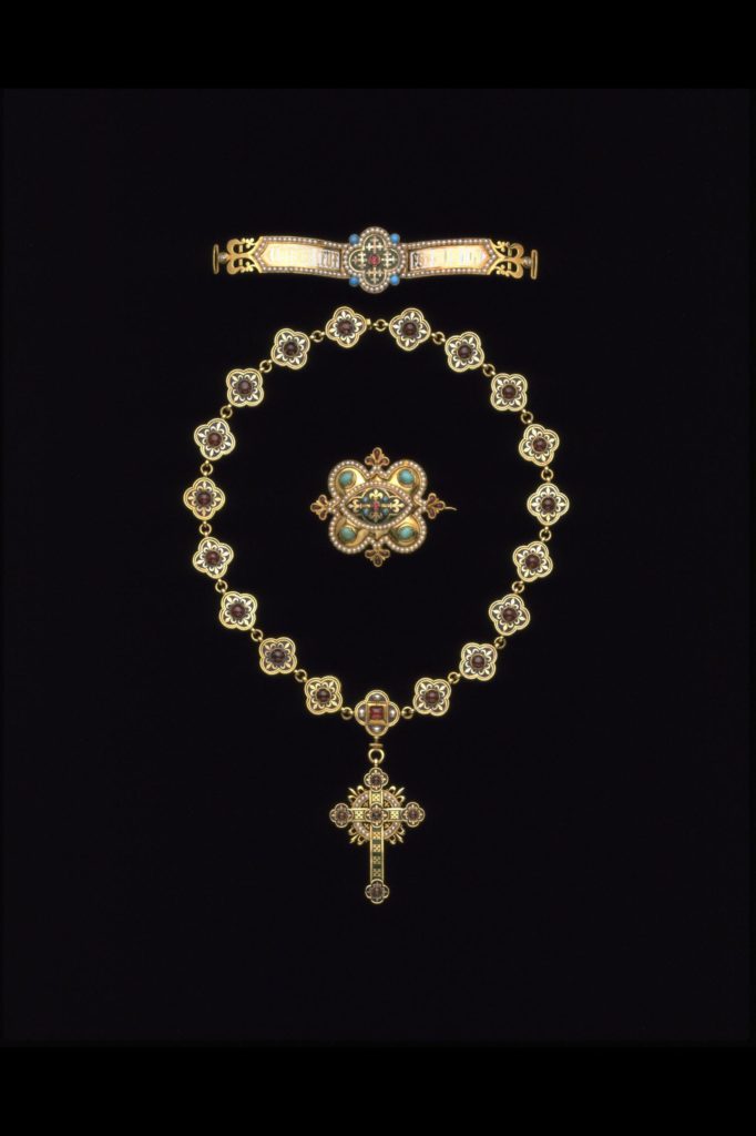 Gothic Revival necklace and pendant were made for Louisa Burton, the second wife of the architect A. W. N. Pugin (1812-1852). Pugin's account with John Hardman & Co. of Birmingham contains an entry on 21 December 1843 for 'A Gold enamel Chain & Cross' costing £47. 15s. Louisa died eight months later. Courtesy V&A.