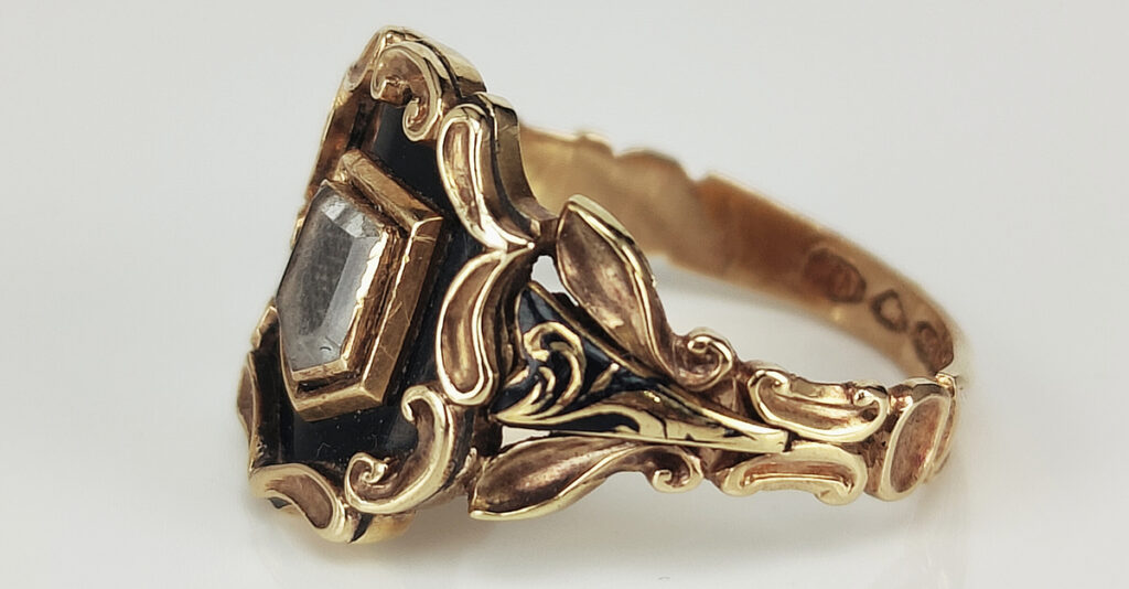 Black enamel mourning ring with hair, inscribed "In memory of Mary OB 9th Oct 1852". Courtesy Kalmar Antiques.