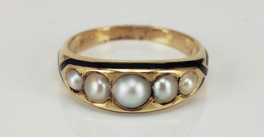 Pearl and stylised serpent mourning ring inscribed "In memory of James / May 1871 aged 26 years". Courtesy Kalmar Antiques.