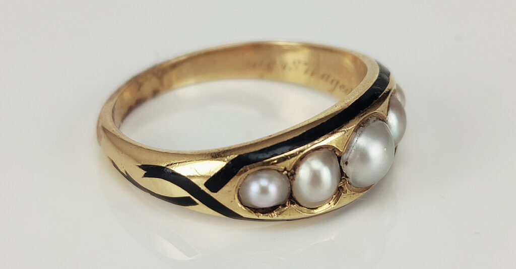Pearl and stylised serpent mourning ring inscribed "In memory of James / May 1871 aged 26 years". Courtesy Kalmar Antiques.