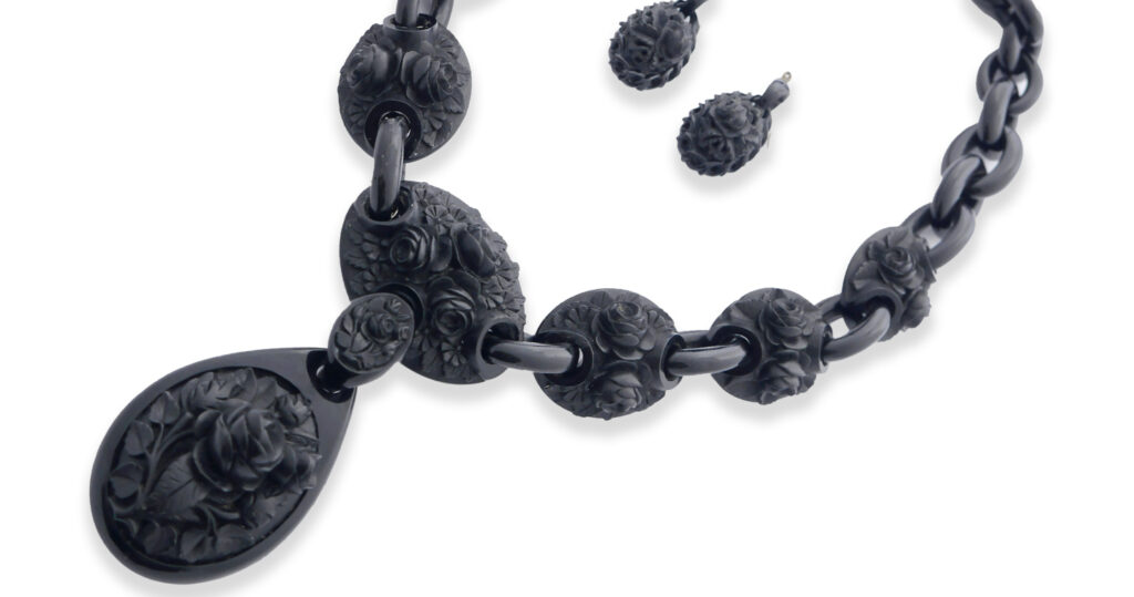 Rose necklace and earrings, made from Whityby Jet courtesy of the Whitby Jet Museum.