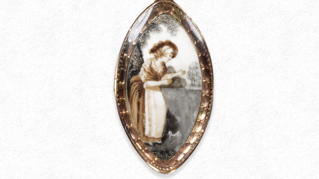 Sentimental scenario of a lady in pastorial scene. Painted sepia tones on ivory set in a pendant. Collection of Hank Griffith / Poe Baltimore.